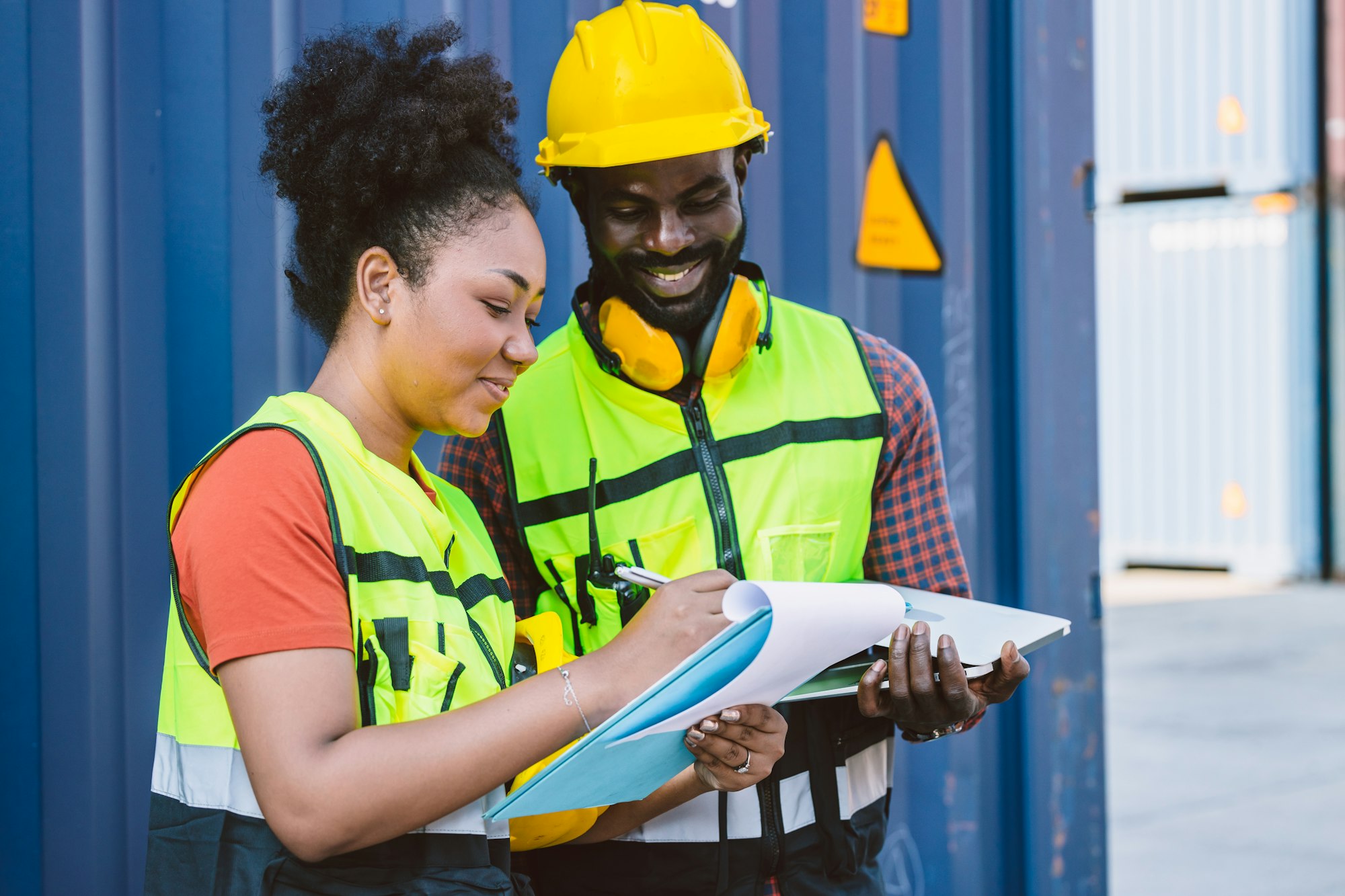 African American customs team staff worker working together with check list shipping