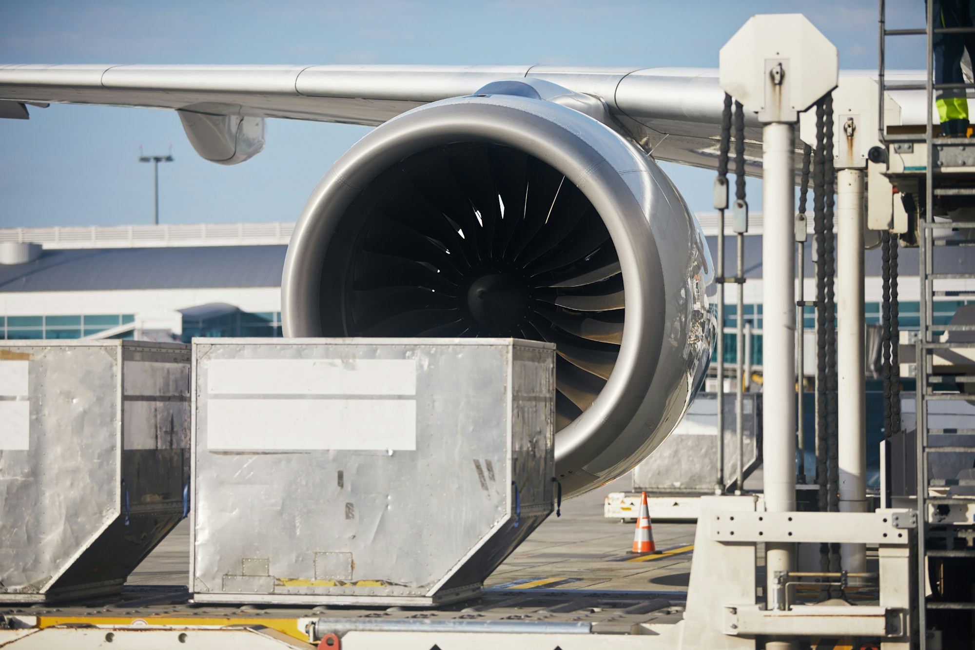 Loading of cargo containers to plane at airport